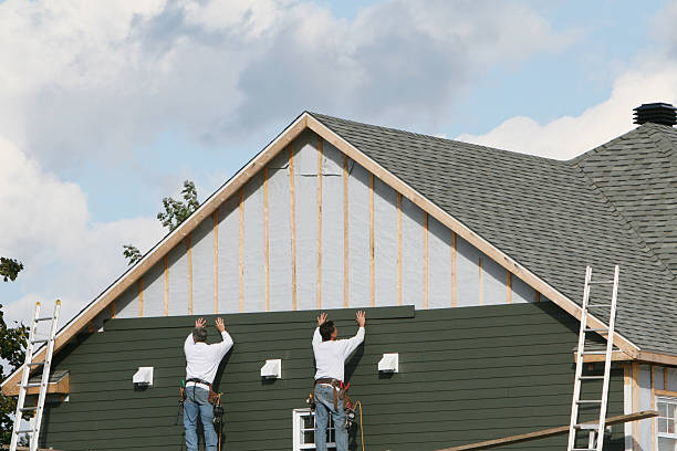 Professional Emergency Siding Repair technician working in Entriken, PA